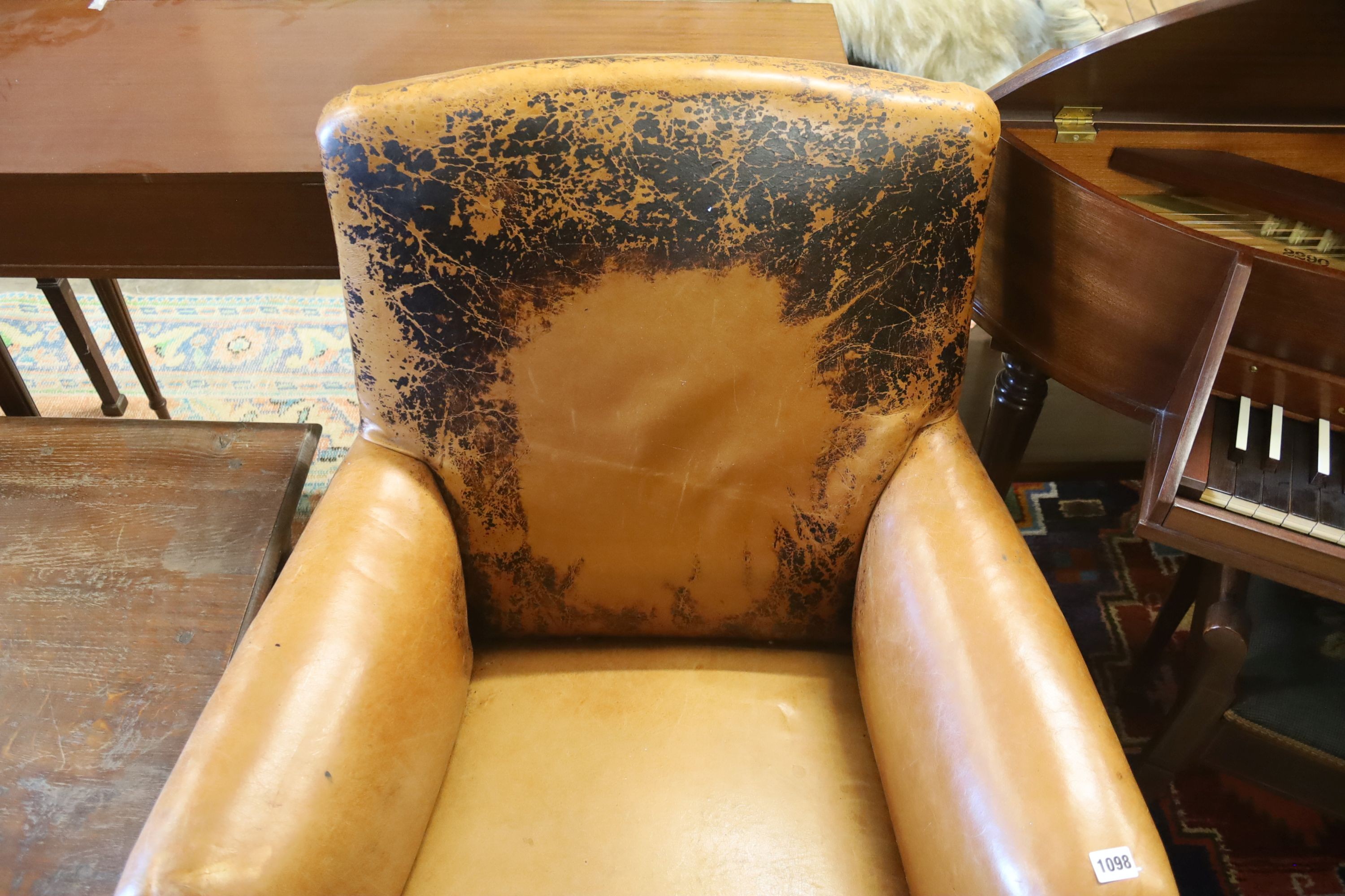 An early 20th century French tan leather club chair, width 78cm, depth 66cm, height 88cm